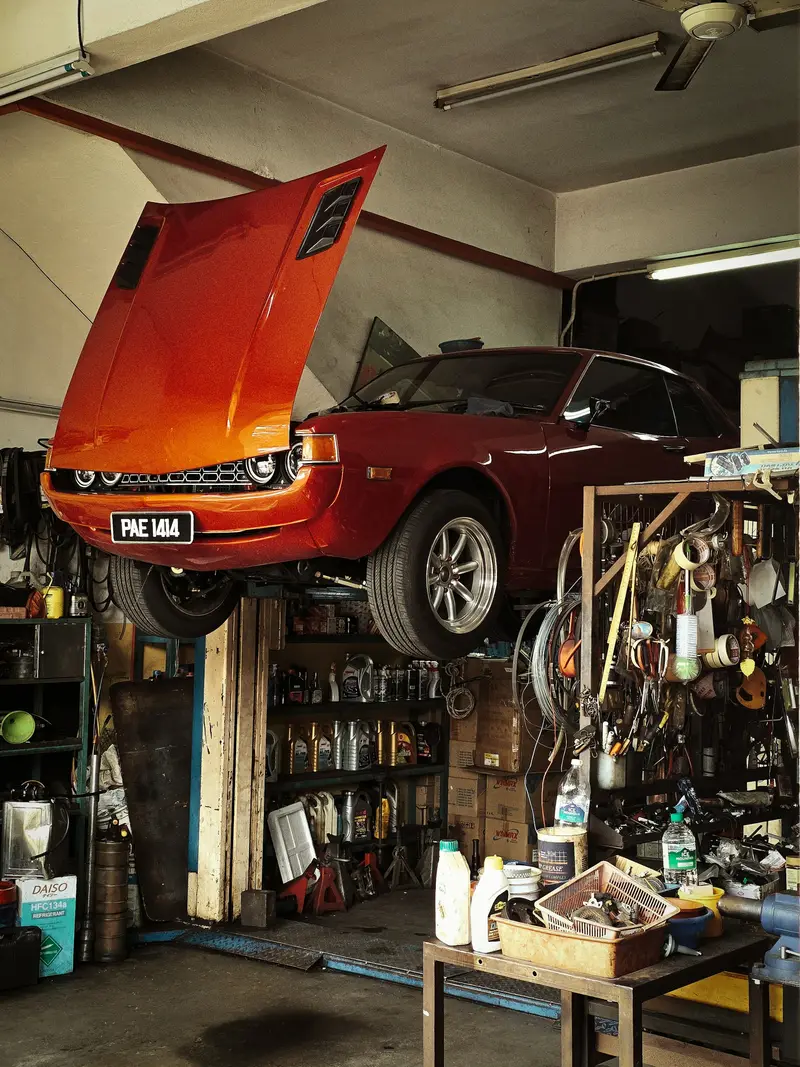 Classic car being repaired in a workshop in Billingshurst